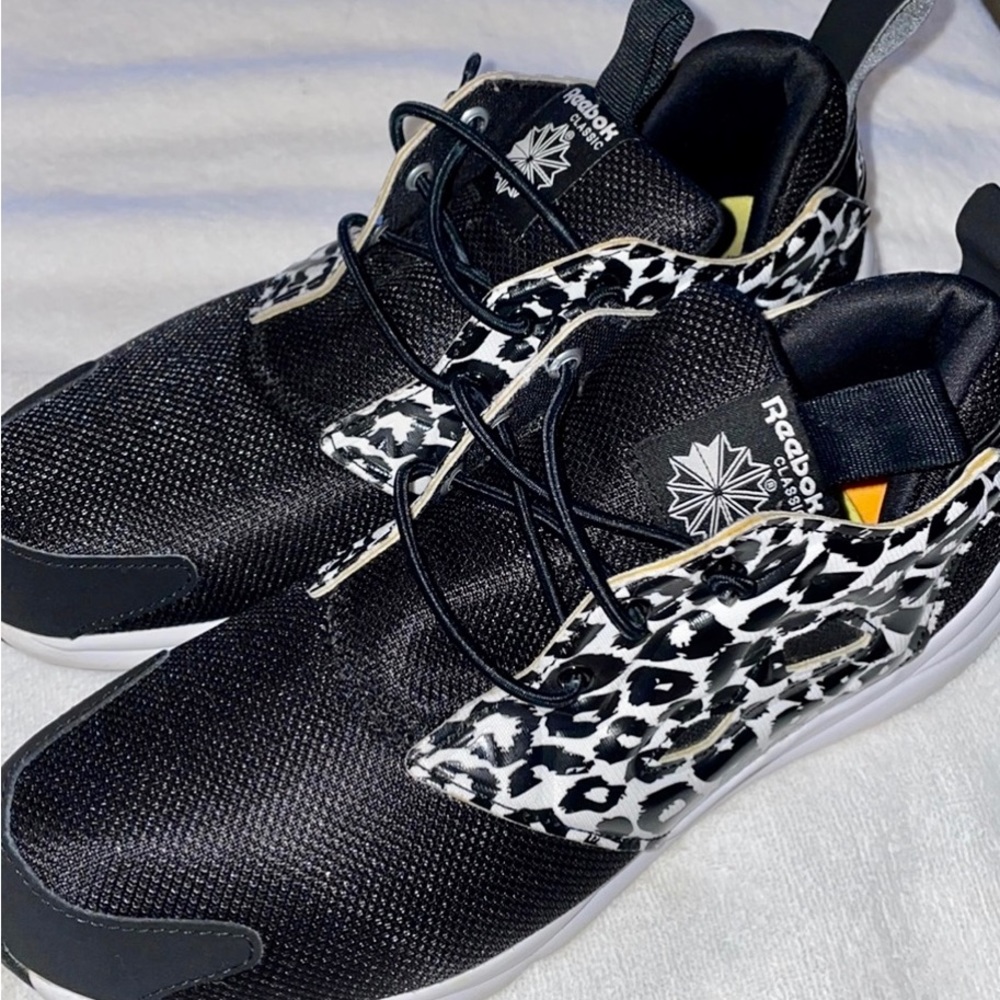 Black and white animal print tennis shoes. Stretch, not tie strings. Like new